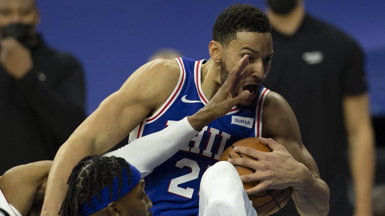 Ben Simmons gets it in the face. Photo by Mitchell Leff/Getty Images.