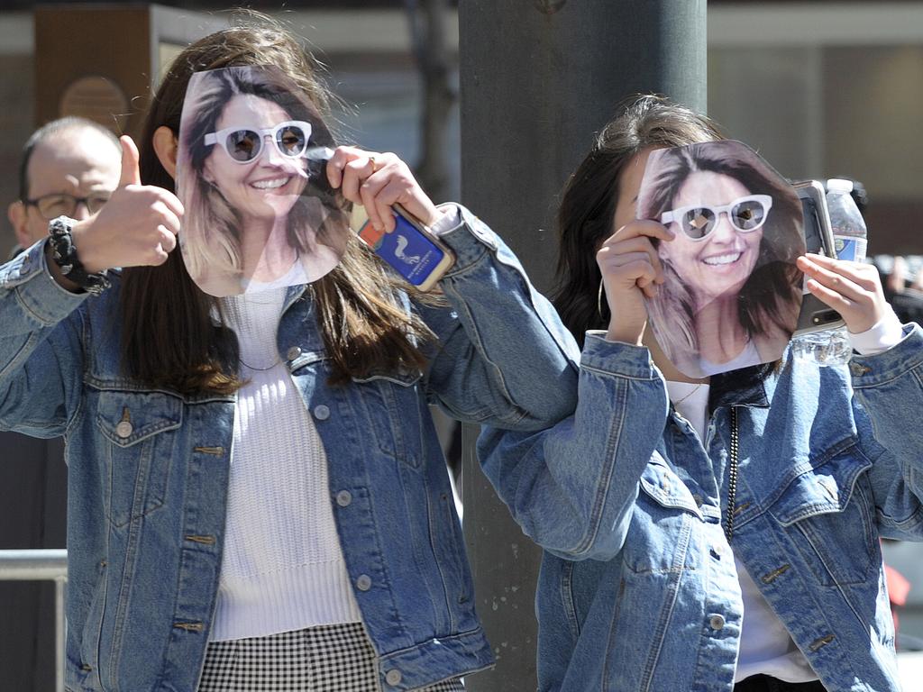 Two girls wear Lori Loughlin masks at the federal court where Loughlin appeared to answer charges stemming from college admissions scandal. Picture: Joseph Prezioso/AFP