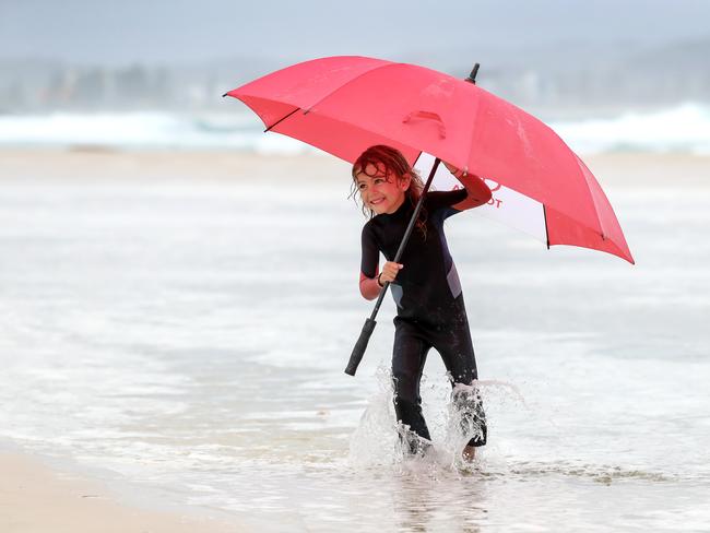 Wet weather on the Gold Coast.Coco Ward, 5 from Rainbow Bay enjoys a day at the beach at Snapper Rocks despite the gloomy weatherPicture: NIGEL HALLETT***** Mum Simone 0408158771 ******