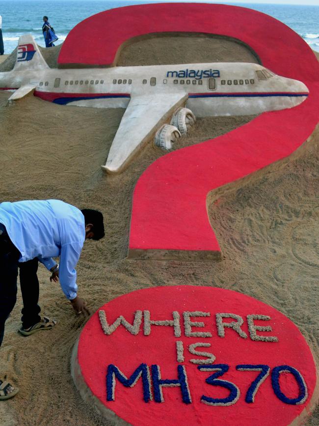 A sand artist poses the question the world still cannot answer six years after MH3270 disappeared. Picture: AFP