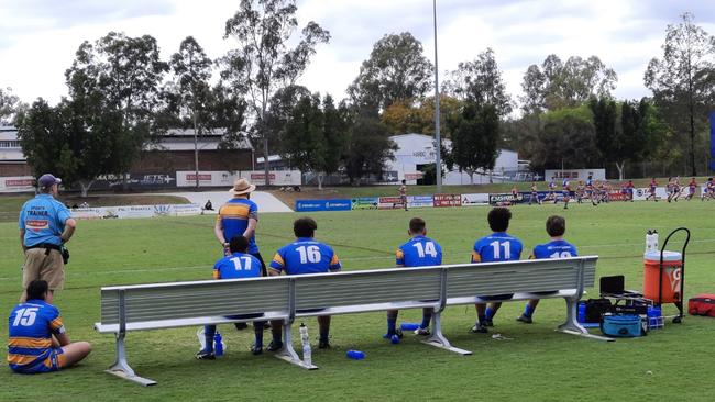 Norths bench players and coach Lee Midgley watch on during the Rugby League Ipswich Colts qualifying final against the Redbank Plains Bears.