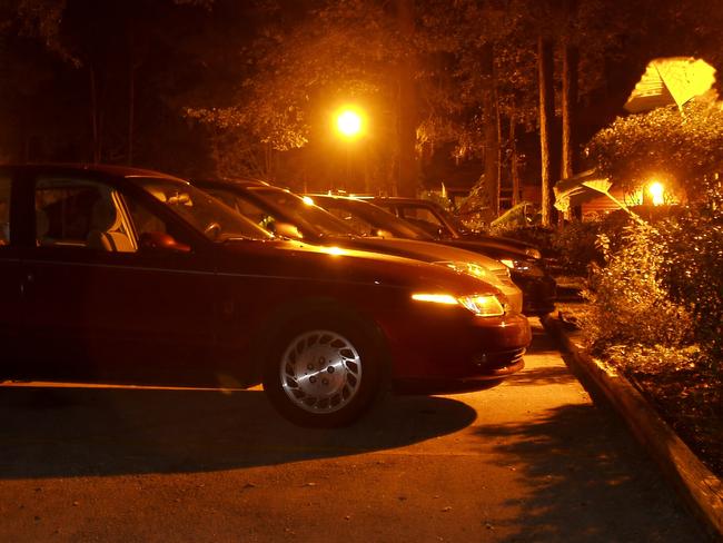 Night shot of a row of cars