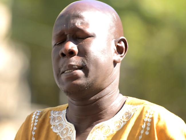 Joseph Manyang, the father of the three children, arrives at an earlier court hearing. AAP Image/Tracey Nearmy