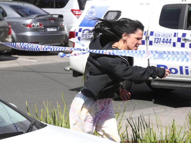 Gavin Preston’s fiancee Lauran Howe runs along the police tape cordoning off the scene. Picture: David Crosling