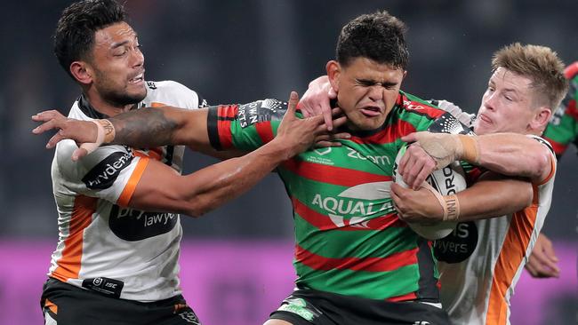 South Sydney’s Latrell Mitchell is caught up in the Wests Tigers’ defence at Bankwest Stadium. Picture: Getty Images