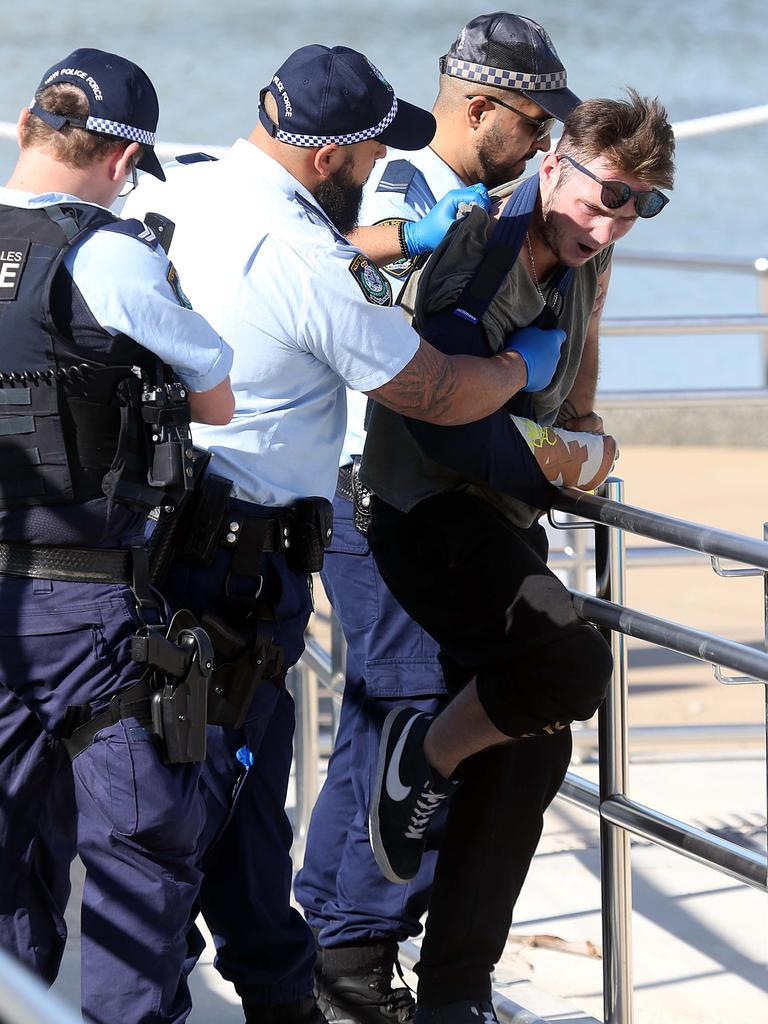 Officers took the man into custody after he allegedly coughed at an officer and claimed to have COVID-19. Picture: Matrix