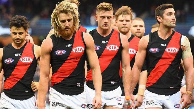 Dyson Heppell leads the Essendon players off the MCG after the loss to Carlton. Picture: Getty