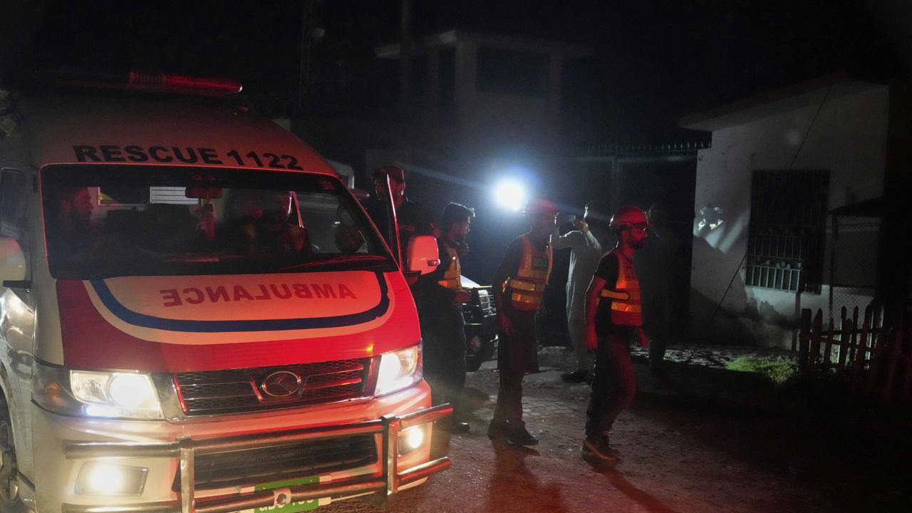 Rescue workers and an ambulance arrive at the site of a suspected Indian missile attack, in Muridke. Picture: AP Photo/K.M. Chaudary