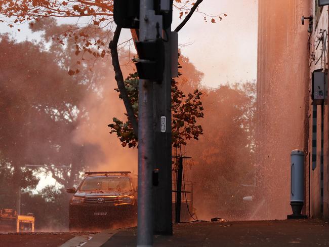 Embers falling on a nearby car. Picture: Jonathan Ng