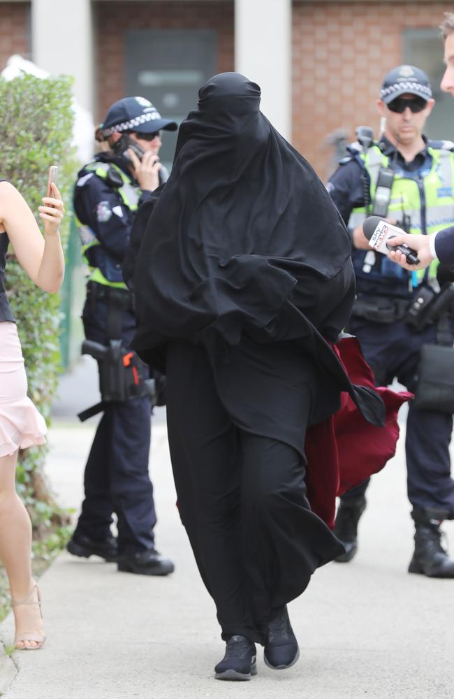 A woman arrives at the Dallas home, where she made rude gestures at the media. Picture: Alex Coppel