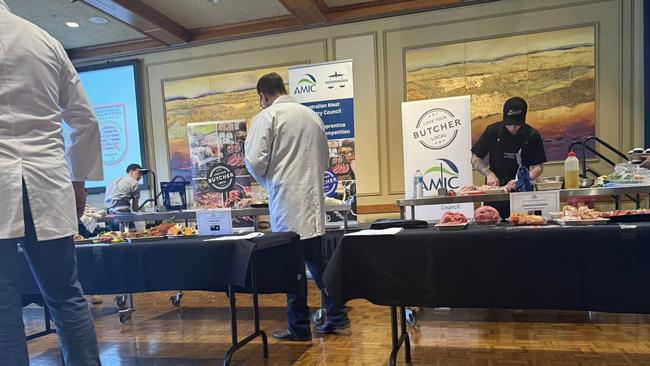 Australian Meat Industry Council judges inspecting the meat at the event. Picture: Dobbie's Butchery / Supplied.