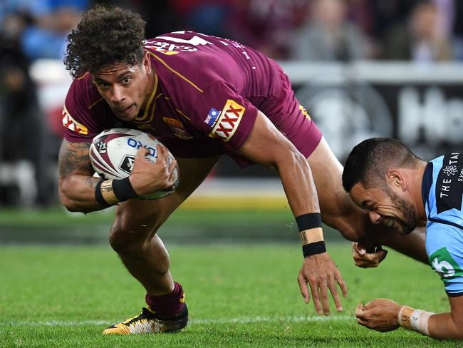 Dane Gagai is tackled by Jarryd Hayne of the Blues during State of Origin Game 3.