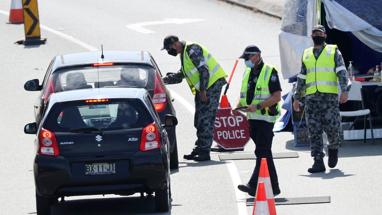 Police and the ADF man the NSW-Queensland border at Coolangatta. Picture: Nigel Hallett