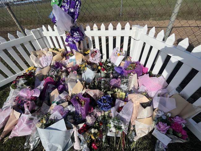 Tributes left at the scene of the triple fatal crash in Maryborough.