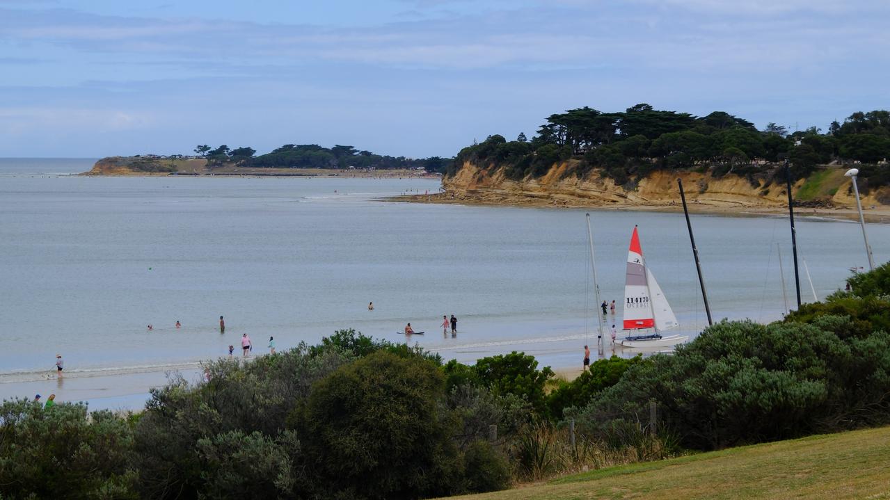 Holiday-makers enjoy Fishermans Beach in Torquay, just across the road from where a man was seriously hurt when a fight broke out at the Wyndham resort. Picture: Shaun Viljoen