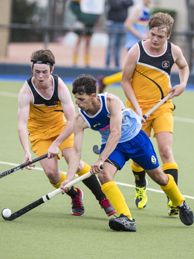 Josh McPaul (centre) of Toowoomba 1 against Sunshine Coast in Hockey Queensland Championships at Clyde Park, Sunday, May 2, 2021. Picture: Kevin Farmer