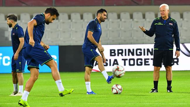 Coach Bernd Stange puts the Syrian players through their paces