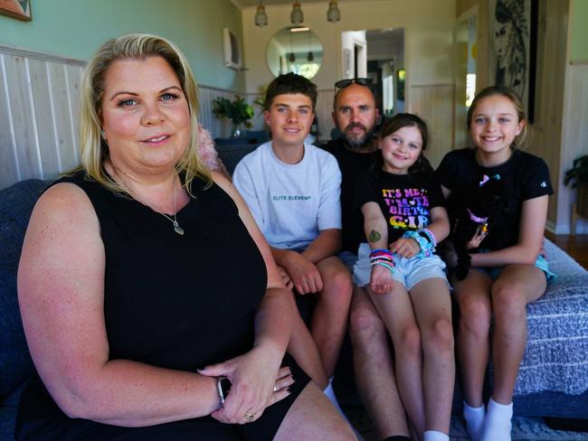 MELBOURNE AUSTRALIA - NewsWire Photos NOVEMBER 3, 2024: Annerley Juhlin-Beeck, rare blood cancer treatment case study, with her husband Wayne Beeck, children Mason (14), Shaylee (11), Imogen (7), and their puppy Daisy at their home in  Avondale Heights.Picture:The Australian / Luis Enrique Ascui