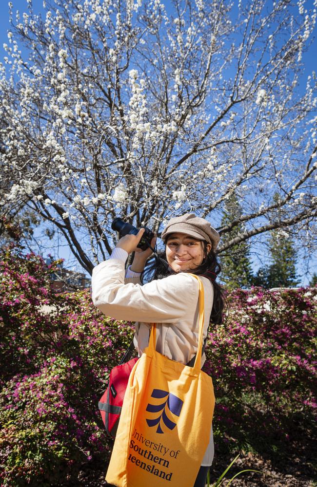 Tarisa Clayton stops to photograph bees at the Open Day at UniSQ, Sunday, August 18, 2024. Picture: Kevin Farmer