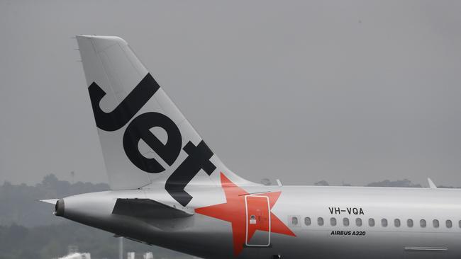 SYDNEY, AUSTRALIA - NewsWire Photos February 25, 2021: QANTAS has reported losses of around 1 billion dollars over the last year, counting the financial cost of Covid-19 on the airline. Jetstar planes are pictured at Sydney airport today. Picture: NCA NewsWire / David Swift