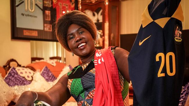 ‘Very happy, very happy’ … Agot Dau Atem after watching her son Awer Mabil score on debut for the Socceroos yesterday. Picture: AAP