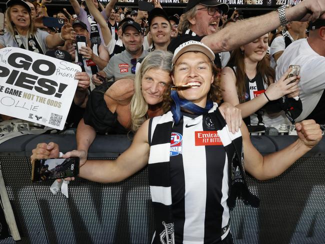 MELBOURNE, AUSTRALIA - SEPTEMBER 30: Jack Ginnivan of the Magpies poses with his Premiership Medal after the 2023 AFL Grand Final match between Collingwood Magpies and Brisbane Lions at Melbourne Cricket Ground, on September 30, 2023, in Melbourne, Australia. (Photo by Darrian Traynor/AFL Photos/via Getty Images)