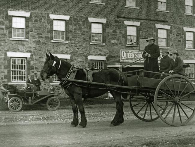 Bill Carpenter, Syd Kean and Frank Dilger in the horse-drawn cart outside Morris’ General Store in Swansea, Tasmania, in 1913. Picture: COURTESY OF GLAMORGAN SPRING BAY HISTORICAL SOCIETY/MAUREEN FERRIS