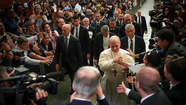 Pope Leo XIV shakes the hands and greets people of the press after an audience with thousands of journalists and media workers. The audience with journalists has become a tradition among newly elected popes. Picture: Christopher Furlong/Getty Images