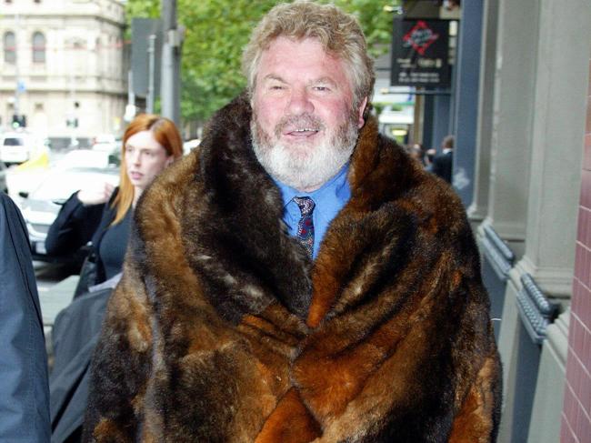 Clark in a possum-skin coat on his way to Federal Court in Melbourne in 2005.