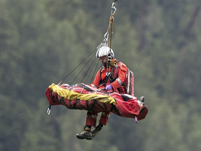 A victim is recovered by helicopter. Picture: Arno Balzarini