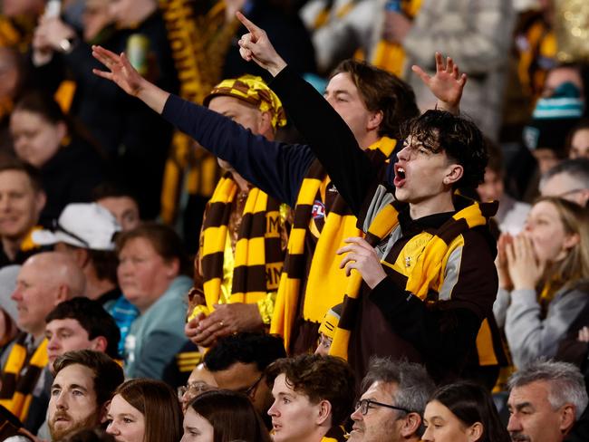 ADELAIDE, AUSTRALIA - SEPTEMBER 13: Hawks fans cheer during the 2024 AFL Second Semi Final match between the Port Adelaide Power and the Hawthorn Hawks at Adelaide Oval on September 13, 2024 in Adelaide, Australia. (Photo by Michael Willson/AFL Photos via Getty Images)