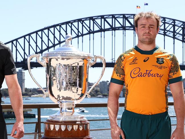 SYDNEY, AUSTRALIA - SEPTEMBER 20: All Blacks captain Scott Barrett and Wallabies captain Harry Wilson pose alongside the Bledisloe Cup during a media opportunity ahead of tomorrow night's Wallabies v All Black Bledisloe Cup match, at Sydney Opera House on September 20, 2024 in Sydney, Australia. (Photo by Jason McCawley/Getty Images)