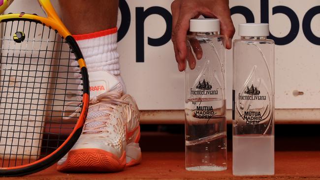 Nadal lines up his water bottles during a match in Spain. Picture: Getty Images