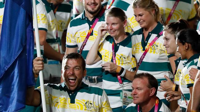 Flag bearer Kurt Fearnley poses for a photograph with teammates during the Closing Ceremony at the Gold Coast 2018 Commonwealth Games on April 15, 2018. (Photo by Michael Willson)