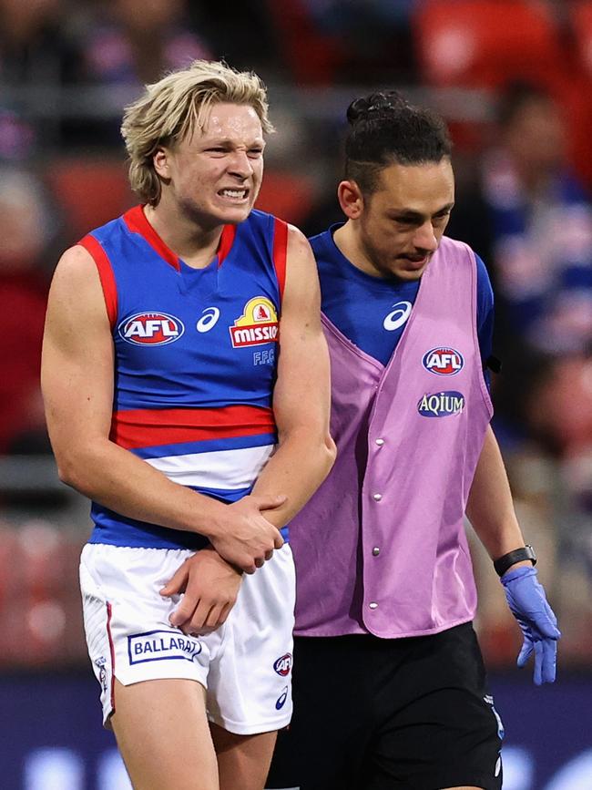 Cody Weightman grimaces in pain after suffering the elbow injury. Picture: Cameron Spencer/Getty Images