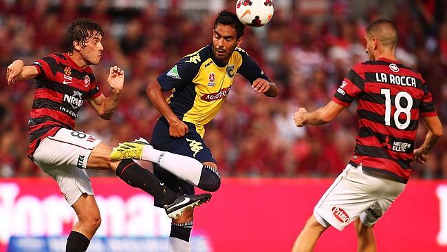 Western Sydney Wanderers midfielder Mateo Poljak and Central Coast Mariners player Marcos Flores contest possession during the Wanderers' recent home game at Pirtek Stadium. Picture: Mark Nolan/Getty Images.