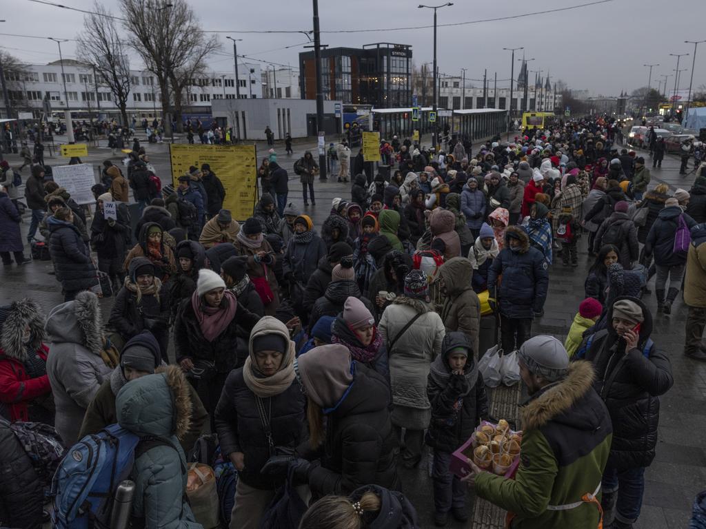 People queue to enter the main rail terminal before making their onward journey Lviv as Russian forces advance toward Kyiv from three sides. Picture: Dan Kitwood/Getty Images