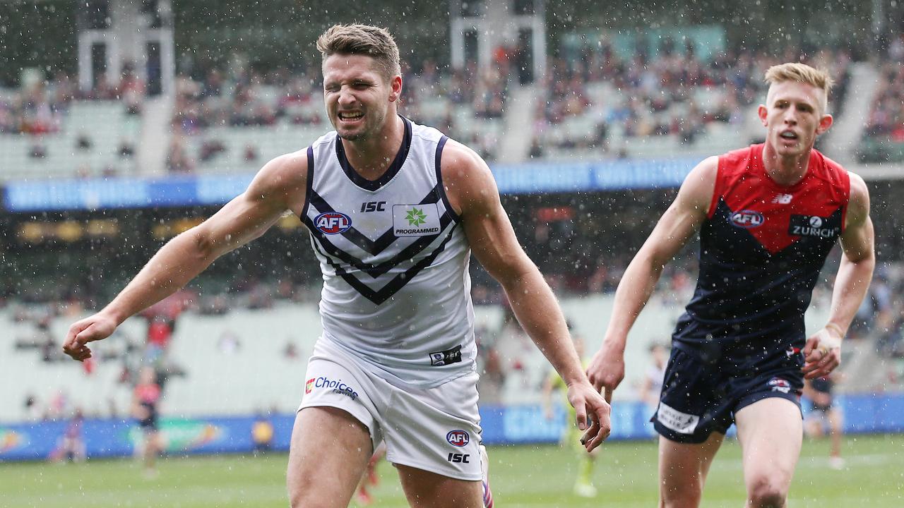 Jesse Hogan grimaces after being injured against Melbourne. Picture: Michael Klein