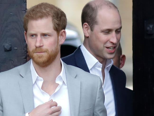 (FILES) In this file photo taken on May 18, 2018 Britain's Prince Harry (L) and his best man Prince William, Duke of Cambridge, (R) arrive to greet well-wishers on the street outside Windsor Castle in Windsor, on the eve of Prince Harry's royal wedding to US actress Meghan Markle. - Britain's Prince Harry said he and his brother Prince William were on "different paths" and admitted occasional tension in their relationship. The Duke of Sussex, 35, has been plagued by rumours of a growing rift between him and 37-year-old William, and he acknowledged that "inevitably stuff happens" given their high-profile roles in the royal family. In an interview with ITV television filmed during his recent tour of southern Africa with his wife Meghan, Harry said: "We are brothers. We will always be brothers. (Photo by Tolga AKMEN / AFP)