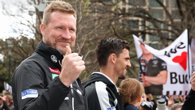 Nathan Buckley gives the thumbs up to Pies fans at the Grand Final Parade. Picture: Getty Images