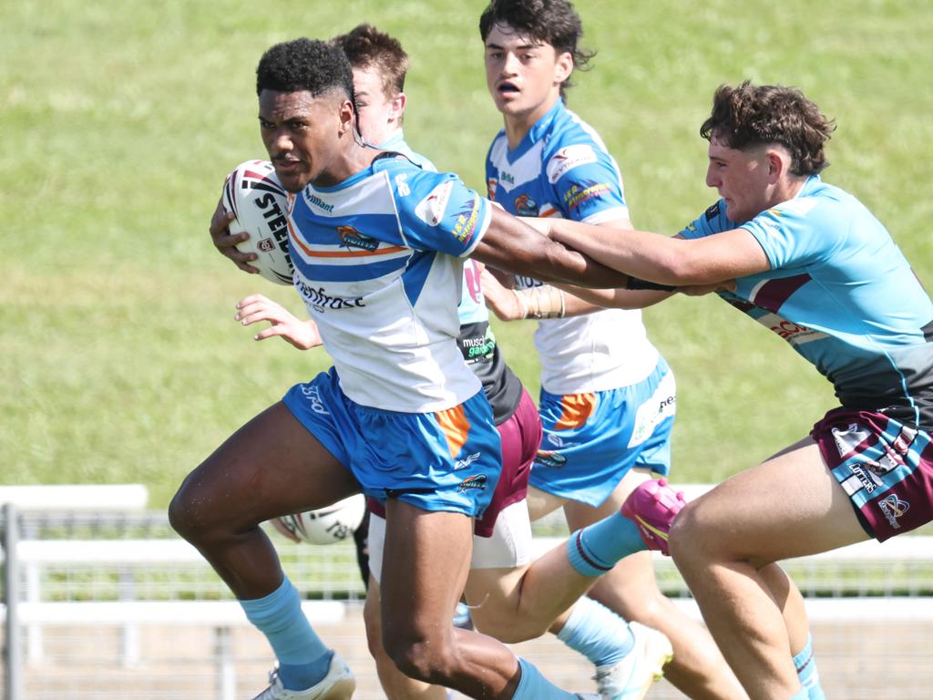 Taakoi Benioni busts through a tackle in the Queensland Rugby League (QRL) Under 19 Men's match between the Northern Pride and the Mackay Cutters, held at Barlow Park. Picture: Brendan Radke