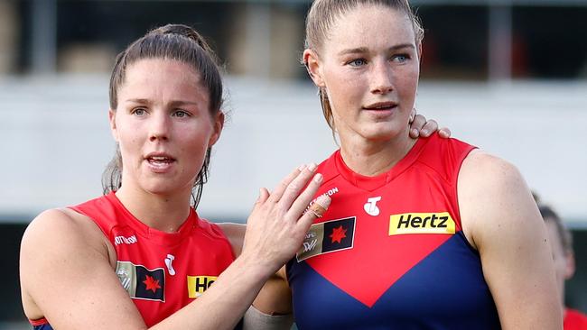 MELBOURNE, AUSTRALIA - NOVEMBER 12: Kate Hore (left) and Tayla Harris of the Demons look dejected after a loss during the 2023 AFLW Second Qualifying Final match between The Melbourne Demons and The North Melbourne Tasmanian Kangaroos at IKON Park on November 12, 2023 in Melbourne, Australia. (Photo by Michael Willson/AFL Photos via Getty Images)