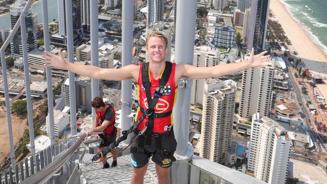 Gold coast Suns player Jack Lukosius on top of the Gold Coast doing the Skypoint climb on Q1. Picture Glenn Hampson