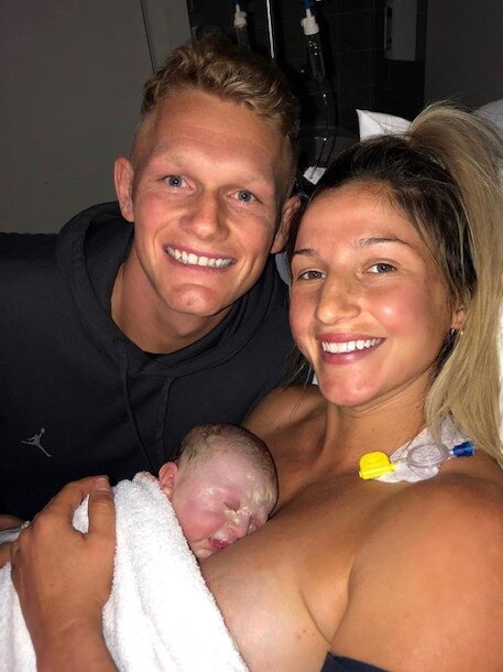 Adam Treloar and Kim Ravaillion following the birth of their daughter, Georgie, in March.