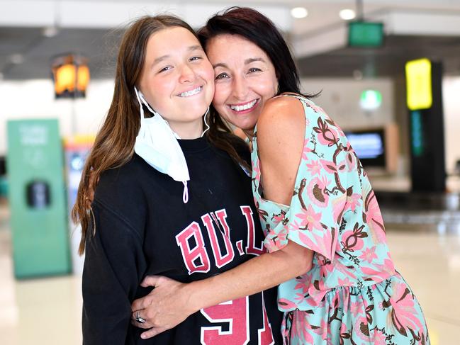 Kym Smith is reunited with daughter Sienna at Brisbane Airport for the first time since March. Picture: Dan Peled/NCA NewsWire