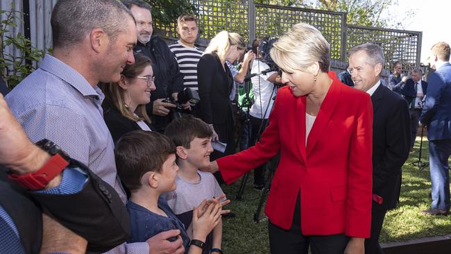 Deputy Opposition Leader Tanya Plibersek speaks to Tom and Peter Davis. Picture: AAP