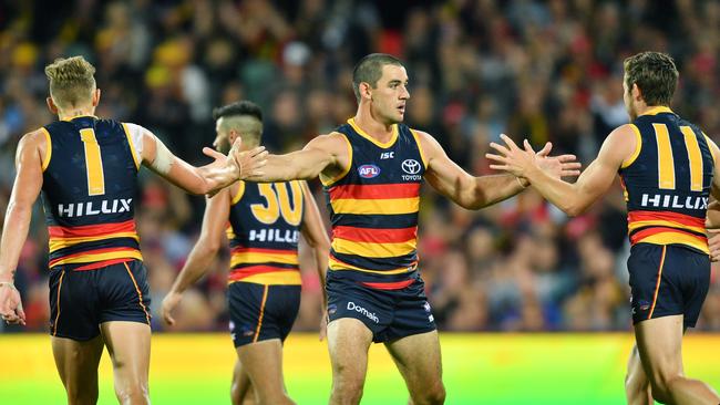 Taylor Walker pumps up his Adelaide Crows teammates at Adelaide Oval on Thursday. Picture: AAP Image/David Mariuz