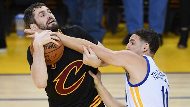 Klay Thompson defends Kevin Love. Picture: AFP