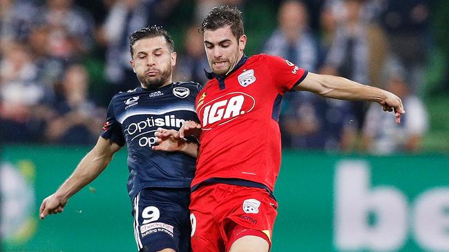 Kosta Barbarouses of the Victory and Ben Garuccio of Adelaide United in the A-League Elimination Final at AAMI Park in April 22. Picture: Getty Images