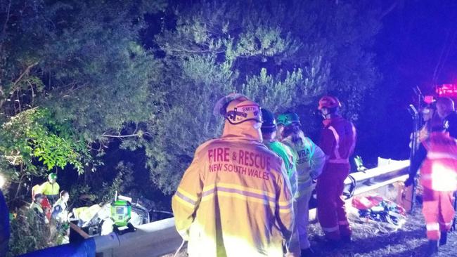 Emergency services have worked together to rescue a woman after her car crashed off the Princes Hwy into Kianga Creek. Picture: Fire &amp; Rescue NSW